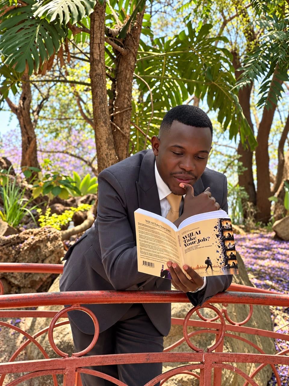 Ngonidzashe Zimbwa with a copy of the book