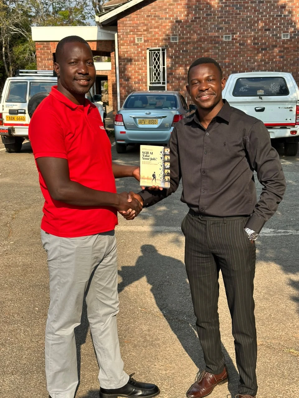 A copy of the book being handed over