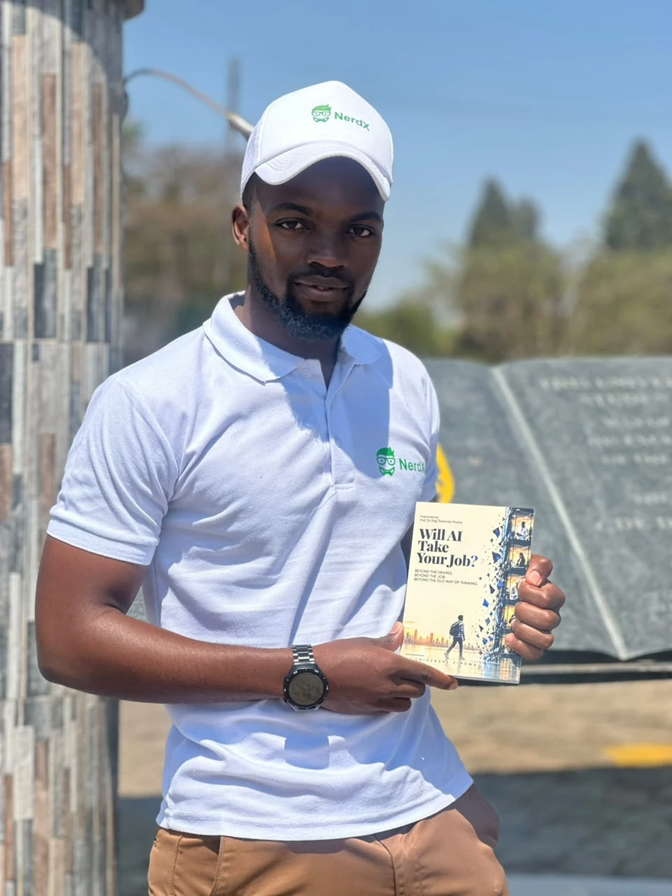 A NerdX team member holding the book